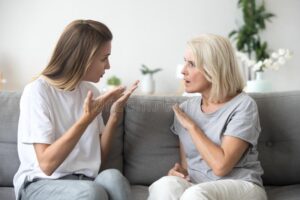 Angry young woman having disagreement annoyed old mother angry young women has disagreement annoyed old mother law